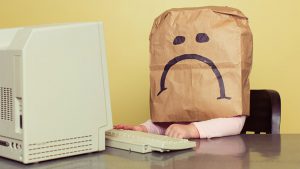 sad sack at a computer